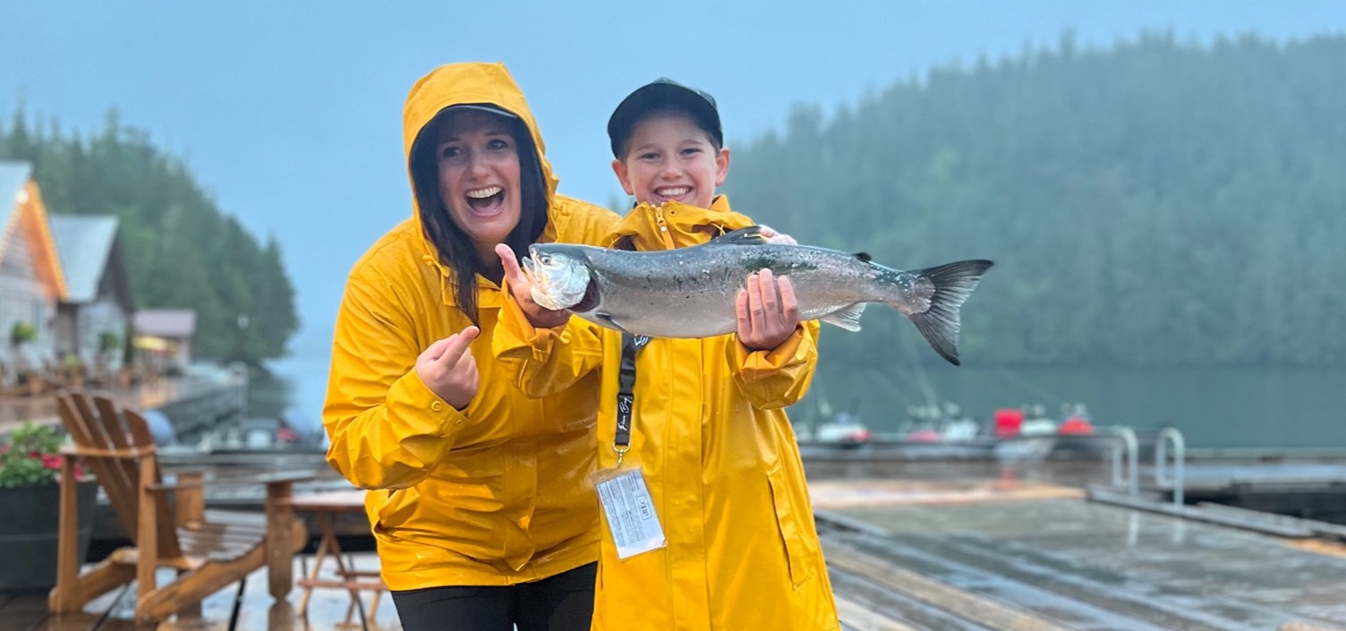 fishing river's inlet british columbia mom and daughter show fish caught with Tidal Charters